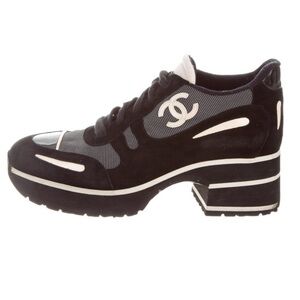 Black suede Chanel sneakers